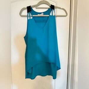 Turquoise tank top with black leather in the back. Medium